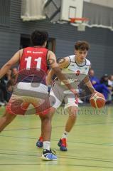 Basketball Bayernliga Herren - Saison 2026/27 - PSV Ingolstadt - TSV Milbertshofen - Petrovic Noel Dian weiss Ingolstadt - Göbel Fabian rot Milbertshofen - Foto: Meyer Jürgen