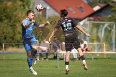 Kreisliga - Saison 2026/27 - SV Hundszell - SV Menning - Christoph Handl blau Hundszell - Noah Kamenjasevic schwarz Menning  - Foto: Meyer Jürgen