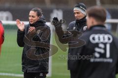 3. Liga; FC Ingolstadt 04 - Trainingsauftakt nach Winterpause; Cheftrainerin Sabrina Wittmann (FCI) Co-Trainer Ilia Gurev (FCI) gratulieren Torwart Marius Funk (1, FCI) zum Geburtstag