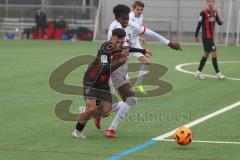 A-Junioren Bundesliga  - Saison 2024/25 - A-Junioren - DFB Vereinspokal - Viertelfinale FC Ingolstadt 04 - SC Freiburg - Berk Beran rot FCI - Nuur Mohamed Billal weiss Freiburg  - Foto: Meyer Jürgen