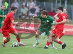 Toto - Pokal - Saison 2026/27 - SV Manching - SV Heimstetten - Sebastian  Graßl (Nr.10 - SV Manching) - Cedric Ildas rechts rot Heimstetten  - Dennis Polat rot Heimstetten  links  - Foto: Meyer Jürgen