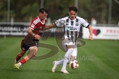 Saison 2026/27 - Freundschaftsspiel - 1. FC Nürnberg - FC Ingolstadt 04 - Andrea Ceresoli (Nr.14 - FCN) - Dennis Kaygin (Nr.10 - FCI) - Foto: Meyer Jürgen