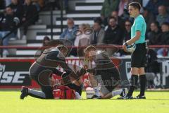 3.Liga - Saison 2023/2024 - SC Verl - FC Ingolstadt 04 - Pascal Testroet (Nr.37 - FCI) verletzt am Boden und muss ausgewechselt werden - Foto: Meyer Jürgen