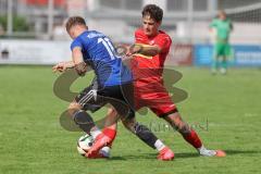 Kreisliga - Saison 2025/26- TSV Kösching - FC Mindelstetten - Lukas Gaul blau Mindelstetten - David Ostermeier rot Kösching - Foto: Meyer Jürgen