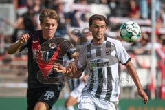 3. Liga - Saison 2026/27 - Victoria Köln - FC Ingolstadt 04  - Tim Kloss (Nr.18 - Viktoria Köln) - Fredrik Carlsen (Nr.8 - FCI) - Foto: Meyer Jürgen