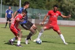 Testspiel - Bezirksliga - Saison 2025/26 - FC Fatih Ingolstadt - TSV Burgheim - Aaron Toski rot Fatih - Nick Vogel blau Burgheim - Atilla Demir rot rechts Fatih - Foto: Meyer Jürgen