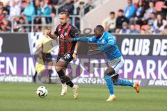 3. Liga; FC Ingolstadt 04 - FC Hansa Rostock; Zweikampf Kampf um den Ball David Kopacz (29, FCI) Kinsombi Christian (27 HR)