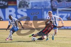3. Liga; FC Hansa Rostock - FC Ingolstadt 04; Zweikampf Kampf um den Ball Marcel Costly (22, FCI) Ruschke Felix (29 HR) Kinsombi Christian (27 HR)