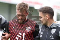 3.Liga - Saison 2023/2024 - SC Verl - FC Ingolstadt 04 - Yannick Deichmann (Nr.20 - FCI)verletzt am Boden und muss ausgewechselt werden - Betreuer auf dem Spielfeld - - Foto: Meyer Jürgen