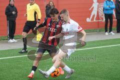 A-Junioren Bundesliga  - Saison 2024/25 - A-Junioren - DFB Vereinspokal - Viertelfinale FC Ingolstadt 04 - SC Freiburg - Lakatos Noel rot FCI - Musch Niklas weiss Freiburg - Foto: Meyer Jürgen