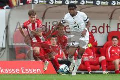3. Liga - Saison 2023/24 - Rot-Weiss Essen - FC Ingolstadt 04 -  - Sascha Voelcke (#2 Essen) - Bryang Kayo (Nr.48 - FCI) - Foto: Meyer Jürgen