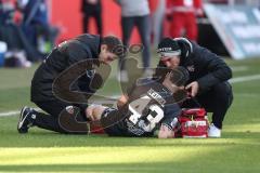 3. Liga - Saison 2024/25 - FC Ingolstadt 04 - 1. FC Saarbrücken - Felix Keidel (Nr.43 - FCI) verletzt am boden - XXXXX - Foto: Meyer Jürgen