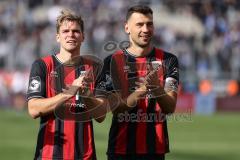 3. Liga; FC Ingolstadt 04 - FC Hansa Rostock; Sieg Jubel Freude 2:1, Spieler bedanken sich bei den Fans Simon Lorenz (32, FCI) Lukas Fröde (34, FCI)