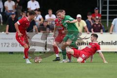 Landesliga - Saison 2024/25 - SV Manching - FSV Pfaffenhofen - Fabian Neumayer (Nr.9 - SV Manching) - Nichael Senger rot Pfaffenhofen rechts -Tobias Killer rot links Pfaffenhofen - Foto: Meyer Jürgen