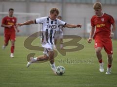 Bayernliga Nord - Saison 2026/27 - FC Ingolstadt 04 II - Jahn Regensburg II - Manuel Distl (Nr.9 - FCI II) - Raphael Steudtner rot Regensburg - Foto: Meyer Jürgen