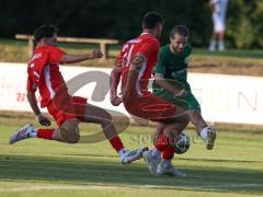 Landesliga - Saison 2026/27 - SV Manching - FC Memmingen II - Tezcan Mustafa rot Memmingen - Daniel Schweiger (Nr.11 - SV Manching) - Schafft Pius rot Memmingen rechts - Foto: Meyer Jürgen