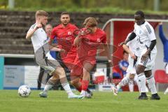 Kreisliga - Saison 2025/26- SV Zuchering - FC Mindelstetten - Philip Delanowski rot Zuchering - Qusseynou Tamba weiß Mindelstetten  - Michael Schneider weiß Mindelstetten  links - Foto: Meyer Jürgen