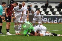 3.Liga - Saison 2023/2024 - SC Verl - FC Ingolstadt 04 - Yannick Deichmann (Nr.20 - FCI)verletzt am Boden und muss ausgewechselt werden - Torwart Luca Unbehaun (Nr.1 - Verl) -  Julian  Klügl (Nr.31 - FCI) - - Foto: Meyer Jürgen