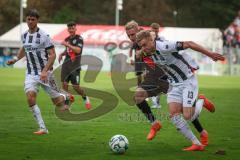 3. Liga - Saison 2026/27 - Victoria Köln - FC Ingolstadt 04  - Lars Lokotsch (Nr.13 - FCI) - Meiko Sponsel (Nr.19 - Viktoria Köln) - Foto: Meyer Jürgen