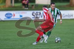 Landesliga - Saison 2025/26 - SV Manching - TSV Dachau  - Fabian  Neumayer (Nr.9 - SV Manching) - Sebastian Mitterhuber rot Dachau - Foto: Meyer Jürgen