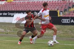 *** Bayernliga Nord - Saison 2025/26 - FC Ingolstadt 04 II - Jahn Regensburg II - Can Paylan (Nr.13 - FC Ingolstadt II) - Seibold Jakob weiss Regensburg - Foto: Meyer Jürgen