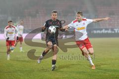3. Liga; SSV Jahn Regensburg - FC Ingolstadt 04; Marcel Costly (22, FCI) Seidel Nick (33 SSV) Zweikampf Kampf um den Ball
