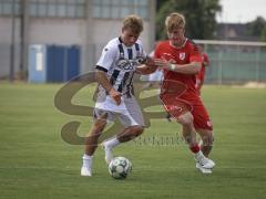 Bayernliga Nord - Saison 2026/27 - FC Ingolstadt 04 II - Jahn Regensburg II - Manuel Distl (Nr.9 - FCI II) - Raphael Steudtner rot Regensburg - Foto: Meyer Jürgen