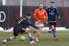 Schanzer Amateurcup 2026 - SV Haunwöhr - SC Irgertsheim - Marco Mosburger orange Irgertsheim - Patrick Mack blau Haunwöhr - Lukas Markus blau Haunwöhr links - Foto: Meyer Jürgen