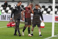 3.Liga - Saison 2023/2024 - SC Verl - FC Ingolstadt 04 - Yannick Deichmann (Nr.20 - FCI)verletzt am Boden und muss ausgewechselt werden - Betreuer auf dem Spielfeld - - Foto: Meyer Jürgen