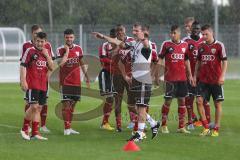 2. BL - FC Ingolstadt 04 - Saison 2013/2014 - Trainingsauftakt - Cheftrainer Marco Kurz gibt Anweisungen bei vollem Regen
