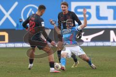 3. Liga - Saison 2025/26 - Hansa Rostock - FC Ingolstadt 04  - Marco Schuster (Nr.5 - Hansa Rostock) - Marcel Costly (Nr.22 - FCI) - Julian Kügel (Nr.29 - FCI) - Foto: Meyer Jürgen